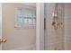 Tiled bathroom with a window and a shower at 560 Bosphorous Ave, Tampa, FL 33606