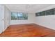 Bright bedroom with hardwood floors and large windows at 560 Bosphorous Ave, Tampa, FL 33606