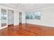 Bright bedroom with hardwood floors and large windows at 560 Bosphorous Ave, Tampa, FL 33606