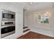 Charming kitchen with stainless steel appliances and a cozy window seat at 560 Bosphorous Ave, Tampa, FL 33606