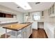 Modern kitchen featuring a center island, sleek countertops, and ample cabinet space at 560 Bosphorous Ave, Tampa, FL 33606