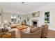Living room featuring a fireplace, hardwood floors, comfortable seating and natural light at 560 Bosphorous Ave, Tampa, FL 33606