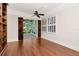 Bright living room featuring a fan and doorway to sunroom at 560 Bosphorous Ave, Tampa, FL 33606