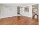 Bright living room featuring hardwood floors, built-in cabinetry and a window to the kitchen at 560 Bosphorous Ave, Tampa, FL 33606