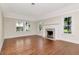 Bright living room with hardwood floors and a classic fireplace at 560 Bosphorous Ave, Tampa, FL 33606