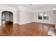 Bright living room featuring beautiful hardwood floors and arched doorway at 560 Bosphorous Ave, Tampa, FL 33606