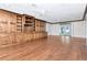 Bright living room with built-in cabinetry, hardwood floors, and backyard view at 560 Bosphorous Ave, Tampa, FL 33606