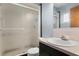 A clean bathroom featuring a frosted glass shower door and single sink vanity at 5860 99Th N Ave, Pinellas Park, FL 33782