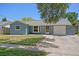 Charming single-story home with a well-maintained lawn and attached one car garage at 5860 99Th N Ave, Pinellas Park, FL 33782
