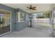 Covered screened-in patio featuring outdoor seating and a bar with backyard views at 5860 99Th N Ave, Pinellas Park, FL 33782
