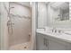 Elegant bathroom showcasing a walk-in shower with glass door and vanity with stone countertop at 615 Dream Island Pl # 210, Longboat Key, FL 34228