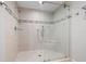 Elegant glass shower with designer tile and built in seat at 615 Dream Island Pl # 210, Longboat Key, FL 34228