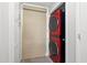 Convenient laundry area features a stacked washer and dryer with extra storage cabinets at 615 Dream Island Pl # 210, Longboat Key, FL 34228