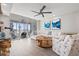 Comfortable living room with modern furniture, ocean view, and hardwood floors at 615 Dream Island Pl # 210, Longboat Key, FL 34228