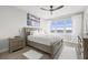 Serene main bedroom with a large window offering water views and soft, natural light at 615 Dream Island Pl # 210, Longboat Key, FL 34228