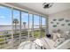 Enclosed lanai boasts stunning water views and plenty of seating at 615 Dream Island Pl # 210, Longboat Key, FL 34228