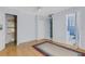 The bedroom features hardwood flooring, a ceiling fan, a closet, and ensuite bathroom at 638 La Jolla Ave, Sun City Center, FL 33573
