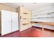 Finished garage with built-in shelves, storage cabinets, a fire extinguisher, and a workbench at 638 La Jolla Ave, Sun City Center, FL 33573
