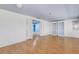 Bright living area with hardwood floors, an open doorway, and built-in shelves, creating an inviting and functional space at 638 La Jolla Ave, Sun City Center, FL 33573