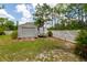 Spacious backyard features a shed, trailer, and white picket fence for secure storage at 7725 235Th E St, Myakka City, FL 34251