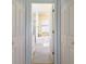 Bright bathroom with marble tub and a view through the closet at 7725 235Th E St, Myakka City, FL 34251