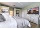 Comfortable bedroom with white dresser and ensuite bathroom at 7725 235Th E St, Myakka City, FL 34251