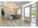Cozy dining room with stylish chandelier, wood floors, and large windows at 7725 235Th E St, Myakka City, FL 34251