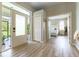 Inviting foyer with wood flooring and an open view to the bedroom at 7725 235Th E St, Myakka City, FL 34251