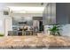 Kitchen with granite countertops, stainless appliances, and gray cabinets at 7725 235Th E St, Myakka City, FL 34251