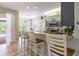 Kitchen counter with breakfast bar and a view into the screened-in pool at 7725 235Th E St, Myakka City, FL 34251