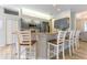 Modern kitchen featuring stainless steel appliances, bar seating, and ample cabinets at 7725 235Th E St, Myakka City, FL 34251