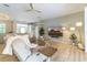 Spacious living room featuring wood floors, cozy seating and backyard access at 7725 235Th E St, Myakka City, FL 34251