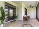 Covered outdoor patio featuring tile floors, ceiling fan and comfortable seating at 7725 235Th E St, Myakka City, FL 34251