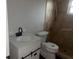 Bathroom featuring a new vanity, modern toilet, and tiled shower at 8033 55Th E St, Palmetto, FL 34221