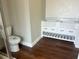 Bathroom with a white double sink vanity, wood-look flooring, and updated fixtures at 8033 55Th E St, Palmetto, FL 34221