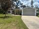 Front exterior of a well-kept single-Gathering home with a two-car garage at 8033 55Th E St, Palmetto, FL 34221