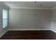 Bright living room with hardwood floors, neutral paint, and large windows at 8033 55Th E St, Palmetto, FL 34221