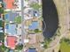Aerial view of a cozy home located on a waterfront property at 832 Birdie Way, Apollo Beach, FL 33572