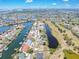Stunning aerial view of a waterfront neighborhood with canals and a golf course at 832 Birdie Way, Apollo Beach, FL 33572