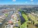 Drone shot showcases waterfront homes near a long winding waterway at 832 Birdie Way, Apollo Beach, FL 33572