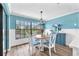 Charming dining area with large windows offering picturesque waterfront views at 832 Birdie Way, Apollo Beach, FL 33572