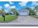 Charming single Gathering home boasting a well maintained lawn, two car garage, and welcoming curb appeal at 832 Birdie Way, Apollo Beach, FL 33572