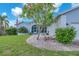 Charming home with a well-manicured front yard, mature landscaping and a welcoming entrance at 832 Birdie Way, Apollo Beach, FL 33572