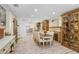 Elegant dining room with decorative fireplace, stylish furnishings, and an open layout at 8903 Donna Lu Dr, Odessa, FL 33556