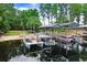 Scenic lake view features a private dock and boat slip, perfect for waterfront living and boating enthusiasts at 8903 Donna Lu Dr, Odessa, FL 33556