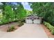 Charming home with a two-car garage, brick-lined driveway, and well-manicured landscaping at 8903 Donna Lu Dr, Odessa, FL 33556