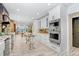 Spacious kitchen with white cabinetry, granite countertops, stainless steel appliances, and wood-look flooring at 8903 Donna Lu Dr, Odessa, FL 33556