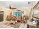 Comfortable living room with unique furniture, a decorative rug, and plenty of natural light at 8903 Donna Lu Dr, Odessa, FL 33556