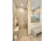 Modern bathroom with tiled walls, a glass-enclosed shower, and a built-in bench at 9024 Barrier Coast Trl, Parrish, FL 34219