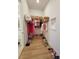 Organized walk-in closet features shelving, hanging racks, wicker baskets and shoe storage at 9024 Barrier Coast Trl, Parrish, FL 34219